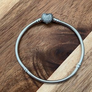 Pandora!!! This bracelet has the classic heart clasp but with a paved flare.